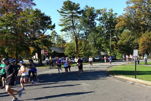 Volunteers from My Sisters’ place act as course monitors in Elizabeth Park along the Hartford Half Marathon route.